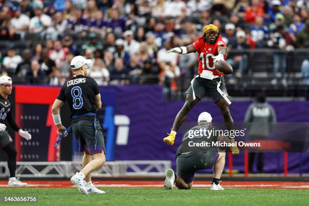 Wide receiver Tyreek Hill of the Miami Dolphins jumps and blocks a pass from NFC quarterback Kirk Cousins of the Minnesota Vikings during an NFL Pro...