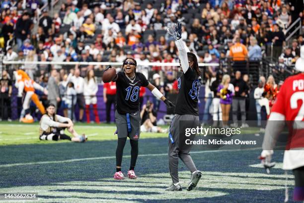 Wide receiver Justin Jefferson of the Minnesota Vikings reacts with NFC wide receiver CeeDee Lamb of the Dallas Cowboys during an NFL Pro Bowl...