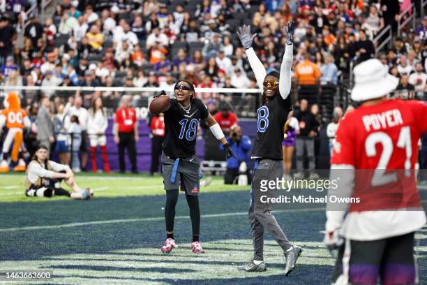 Wide receiver Justin Jefferson of the Minnesota Vikings reacts with NFC wide receiver CeeDee Lamb of the Dallas Cowboys during an NFL Pro Bowl...