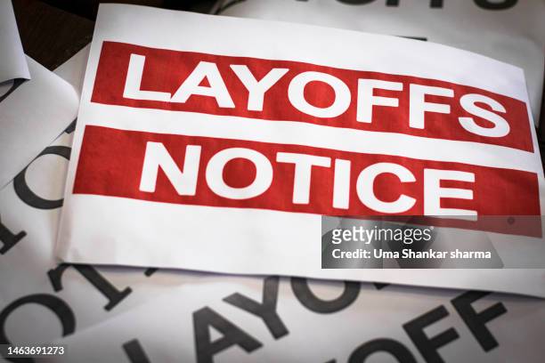 a large stack of papers with notice of layoff and layoff list. - printer frustration stock pictures, royalty-free photos & images
