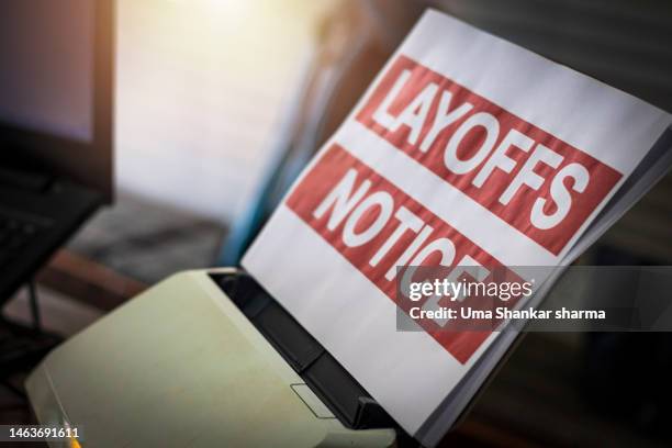 printed layoff notice in office. - printer frustration stock pictures, royalty-free photos & images