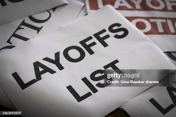 a large stack of papers with notice of layoff and layoff list. - printer frustration stock pictures, royalty-free photos & images