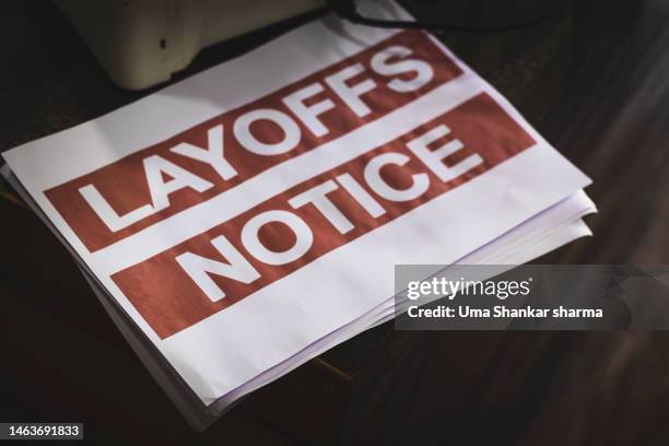 closeup shot of printed layoff notice. - señal de información fotografías e imágenes de stock