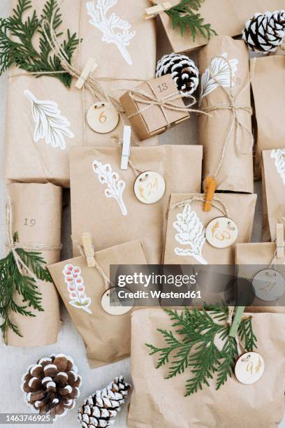 decorated paper bags for advent calendar - advent calendar stock pictures, royalty-free photos & images