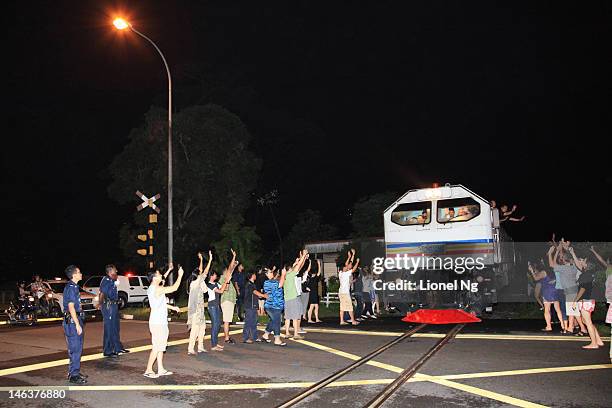 The Sultan of Johor, Sultan Ibrahim Iskandar drives the last Keretapi Tanah Melayu train from Tanjong Pagar station past the Bukit Panjang level...