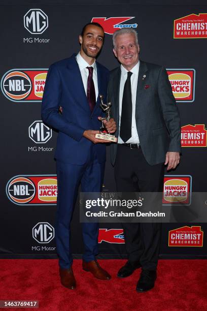 Xavier Cooks of the Kings poses with Andrew Gaze after being presented with the Andrew Gaze Trophy for Most Valuable Player presented by Hungry Jacks...