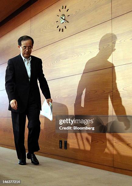 Masaaki Shirakawa, governor of the Bank of Japan, leaves a news conference in Tokyo, Japan, on Friday, June 15, 2012. The Bank of Japan kept the size...