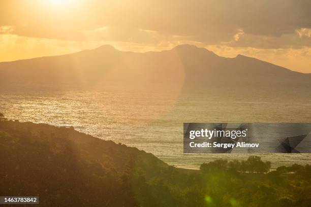 sunlit landscape with islands and sea - dodecanese islands stock pictures, royalty-free photos & images