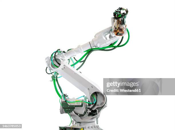 robot arm against white background - brazo robótico fotografías e imágenes de stock