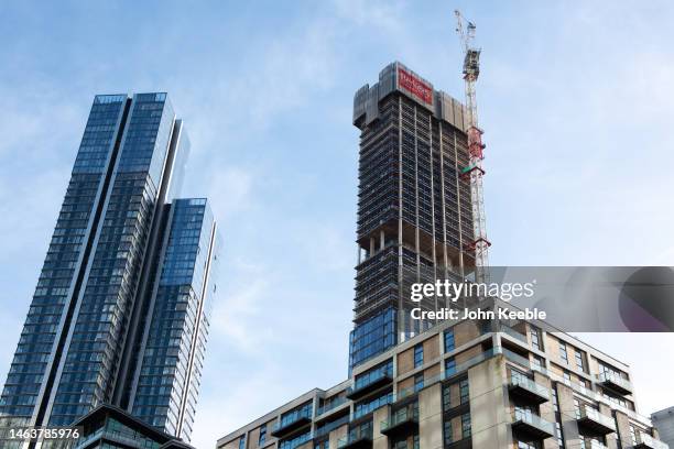 High-rise luxury apartment buildings Hampton Tower and Harcourt Gardens under construction with Berkely at South Quay Plaza in Canary Wharf on...