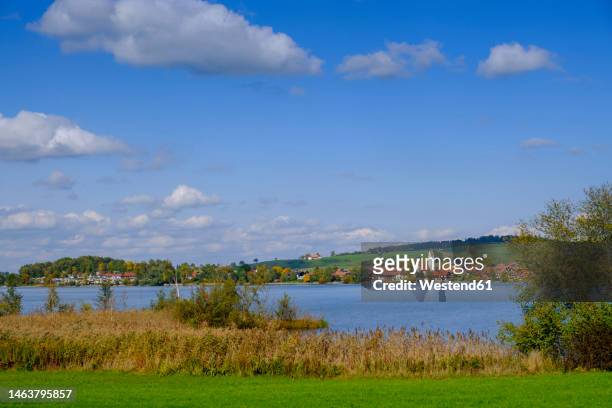 germany, bavaria, riegsee, riegsee lake and surrounding landscape in sunshine - lake riegsee stock pictures, royalty-free photos & images