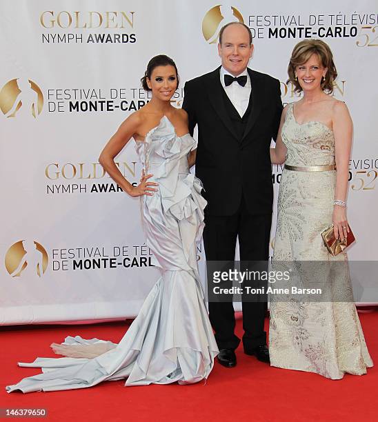 Prince Albert II of Monaco poses with actress Eva Longoria and Anne Sweeney as they arrive at the Golden Nymph Award during the 52nd Monte Carlo TV...