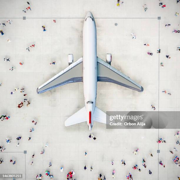 aerial view of crowd with airplane. - airport from above stock pictures, royalty-free photos & images