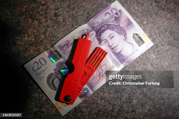 In this photo illustration a prepay electricity key sits in on a 20 GBP note in a rented home on February 07, 2023 in Birmingham, England. Ofgem has...