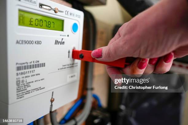 In this photo illustration a prepay electricity key sits in a prepayment electricity meter in a rented home on February 07, 2023 in Birmingham,...