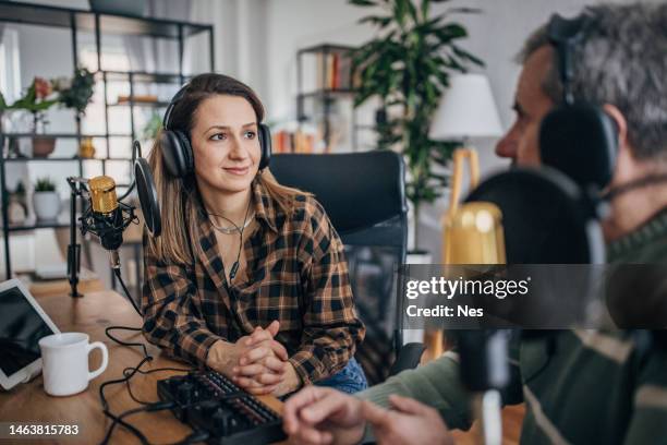 podstaker, a young woman makes a podcast in the studio - table of content stock pictures, royalty-free photos & images