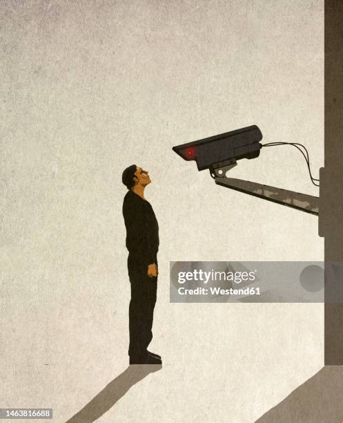 ilustraciones, imágenes clip art, dibujos animados e iconos de stock de illustration of man standing in front of security camera - cámara de seguridad