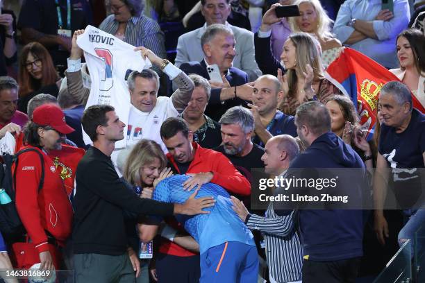 Novak Djokovic of Serbia celebrates winning championship point with Dijana Djokovic, Goran Ivanisevic and his player box in the Men’s Singles Final...