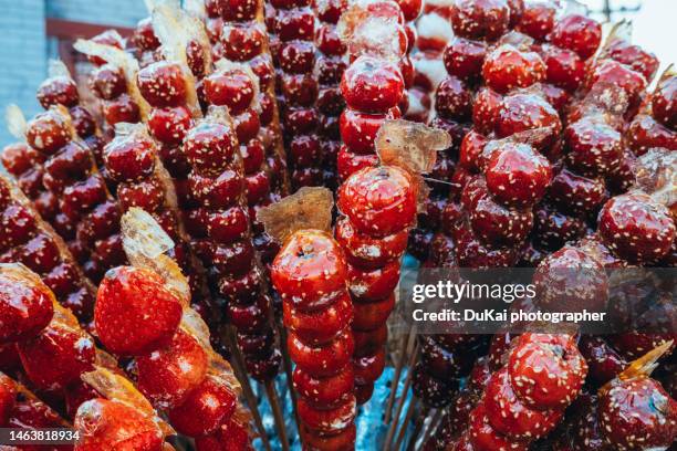 winter snacks in beijing china-bingtanghulu - hawthorn location stock pictures, royalty-free photos & images