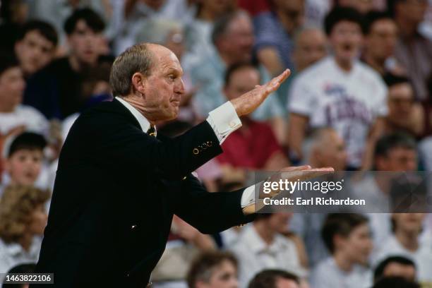 Norm Stewart, Head Coach for the University of Missouri Tigers gives out hand sign instructions to his players during the NCAA Big-8 Conference...