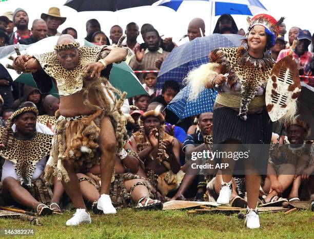 South African President Jacob Zuma sings and dances with his newlywed Tobeka Madiba at their wedding ceremony on January 4, 2010 in a colourful Zulu...