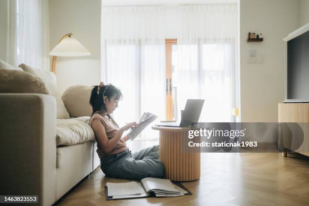 asian woman planning budget and using calculator on smartphone. - manage invest stockfoto's en -beelden