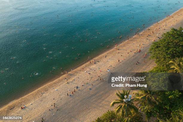 waves on nha trang beach - nha trang stock pictures, royalty-free photos & images