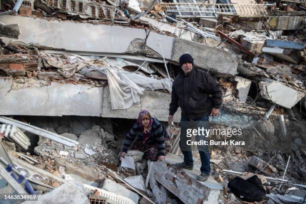 People search the collapsed building to hear a sound from their loved ones, on February 07, 2023 in Hatay, Turkey. A 7.8-magnitude earthquake hit...
