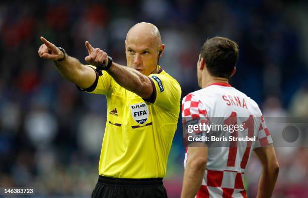 Referee Howard Webb gestures during the UEFA EURO 2012 group C match between Italy and Croatia at The Municipal Stadium on June 14, 2012 in Poznan,...