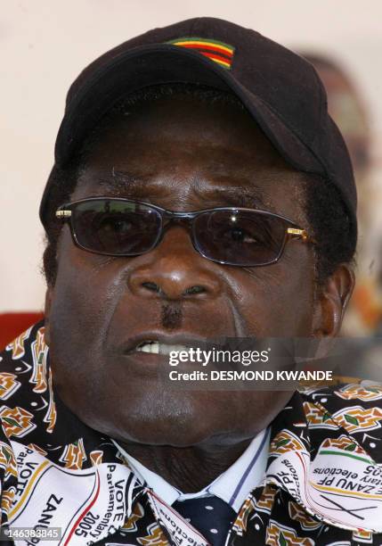 Zimbabwe's President Robert Mugabe speaks to supporters at a rally in Banket, 70 kms from Harare on June 24, 2008. President Mugabe said the...