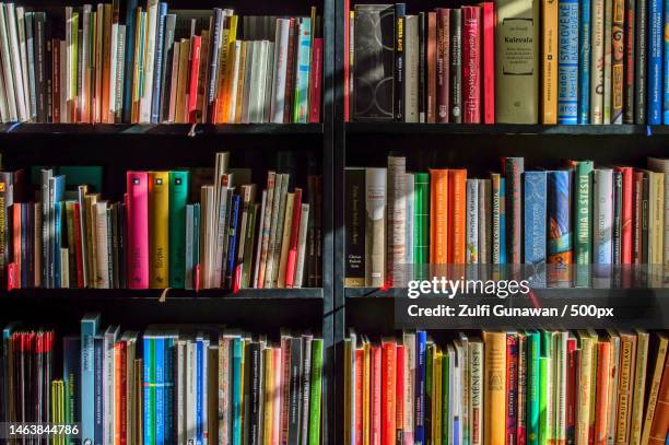 full frame shot of books in shelf,indonesia - book spine stock pictures, royalty-free photos & images