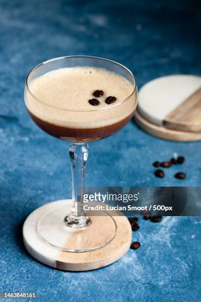 closeup of espresso martini with coffee bean garnish,united states,usa - espresso martini stock pictures, royalty-free photos & images