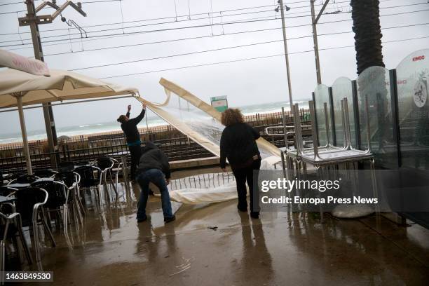 Workers on the Badalona promenade on February 7 in Badalona, Barcelona, Catalonia, Spain. The State Meteorological Agency has activated the orange...