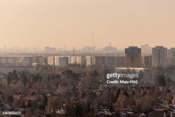 East Germany-era apartment buildings stand in Marzahn district on the eastern city outskirts as the broadcast tower at Alexanderplatz stands behind...