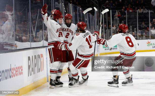 Jack Bar of the Harvard Crimson celebrates his goal during the first period, that was eventually disallowed due to too many men on the ice, with his...