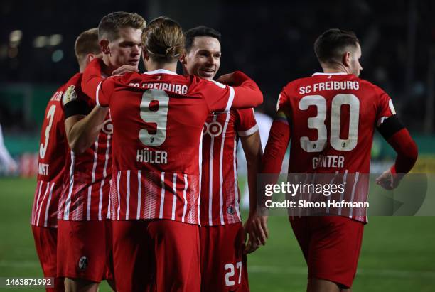 Matthias Ginter, Lucas Höler, Nicolas Höfler and Christian Günter of Freiburg celebrate their team's goal during the DFB Cup round of 16 match...