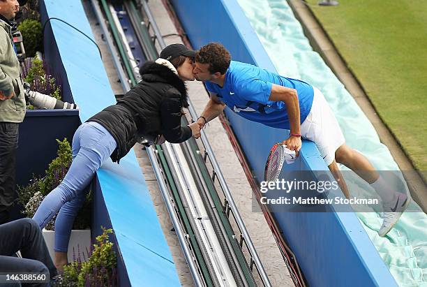 Grigor Dimitrov of Bulgaria kisses his girlfriend Simona Stefanova as he celebrates winning his mens singles quarter-final round match against Kevin...