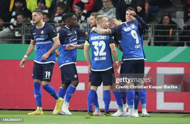 Mathias Honsak of Darmstadt celebrates with his team mates after scoring his team's first goal during the DFB Cup round of 16 match between Eintracht...