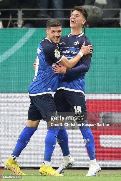 Mathias Honsak of Darmstadt celebrates scoring his team's second goal during the DFB Cup round of 16 match between Eintracht Frankfurt and SV...