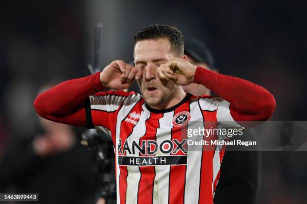Billy Sharp of Sheffield United, simulates crying as they taunt fans of Wrexham following their side's defeat, during the Emirates FA Cup Fourth...