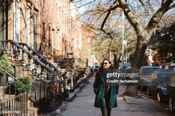 young woman enjoying the walk in brooklyn, nyc - brooklyn autumn stock pictures, royalty-free photos & images