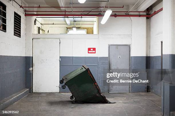 tilted dumpster in garage - quicksand stock pictures, royalty-free photos & images