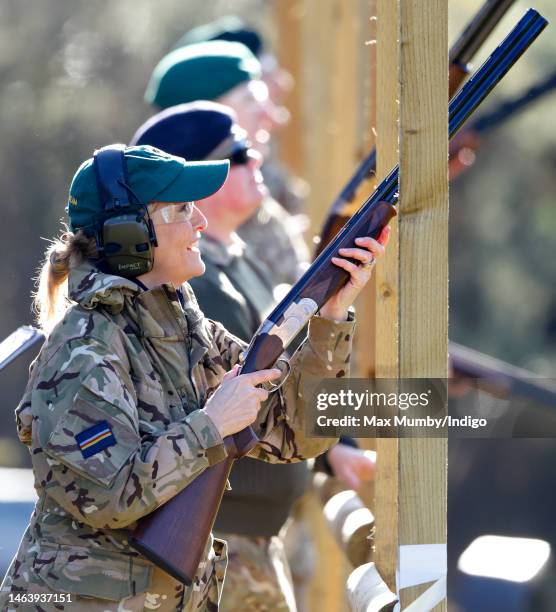 Sophie, Countess of Wessex wears a pair of ear defenders, safety glasses and baseball cap as she takes part in a clay pigeon shoot during the...