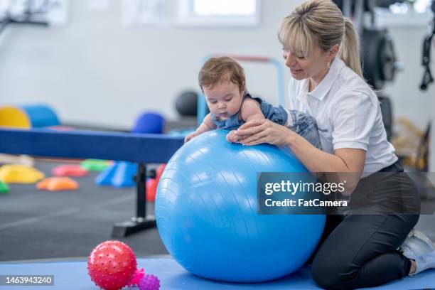 infant physical therapy - sensory perception stock pictures, royalty-free photos & images