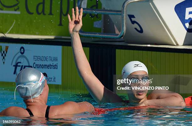 Japanese swimmer Aya Terakawa celebrates, next to Russia's Anastasia Zueva, her winnining in the women's 100-metre backstroke final at the Settecolli...