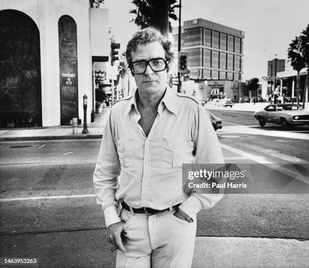 Michael Caine, actor, producer, and author. Renowned for his distinctive working class cockney accent, stands on a street corner May 24, 1984 in...