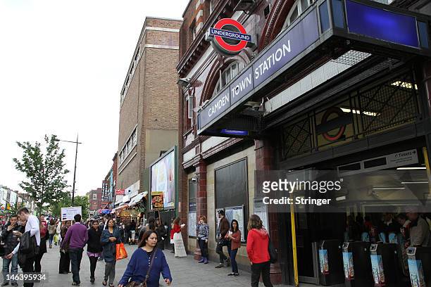 People walk past Camden town tube station in Camden Town, an area in North London that attracts visitors all year round and is famed for its market,...