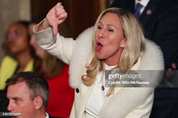 Rep. Marjorie Taylor Greene gives a thumbs down during President Joe Biden's State of the Union address during a joint meeting of Congress in the...