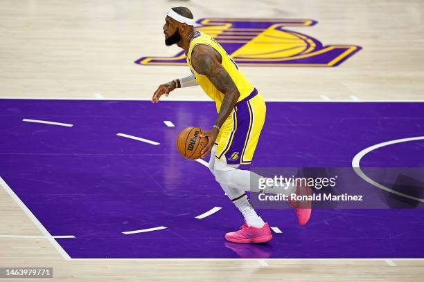 LeBron James of the Los Angeles Lakers handles the ball during the first half of a game against the Oklahoma City Thunder at Crypto.com Arena on...