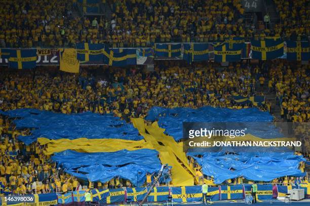 Fans form a Swedish flag before the Euro 2012 championships football match Sweden vs England on June 15, 2012 at the Olympic Stadium in Kiev. AFP...
